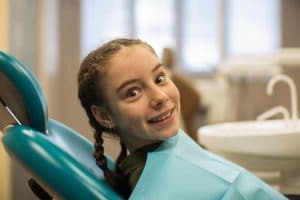 young girl happy at the dentist's office